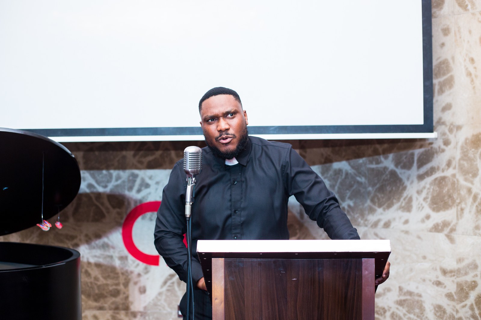 The Verse - Spoken word poet performing passionately at Creative Convos