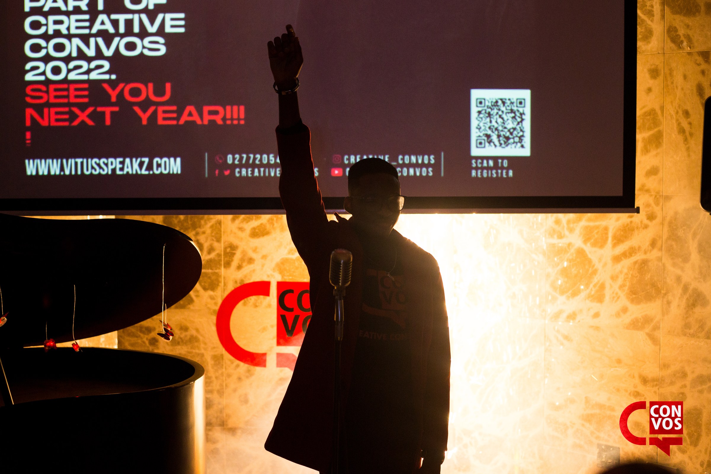 Creative Convos live poetry experience performer on stage in Accra